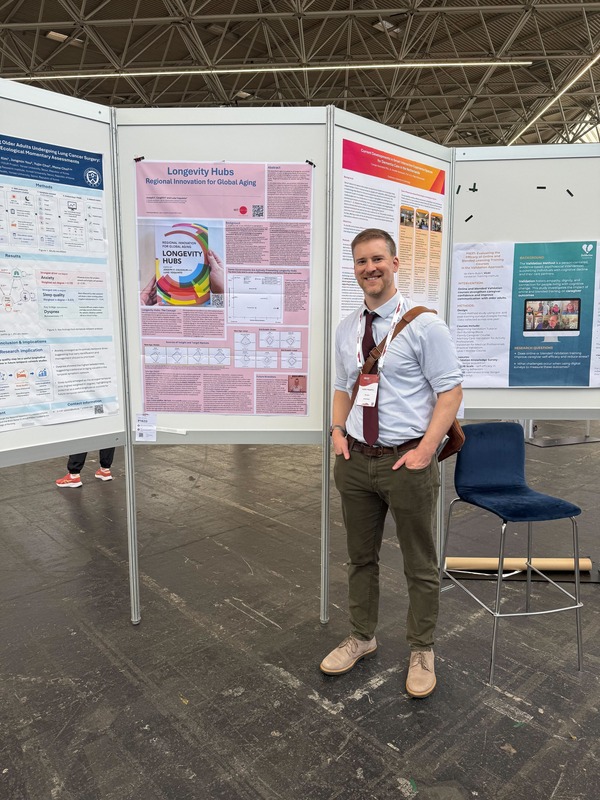 Yoquinto beside his poster