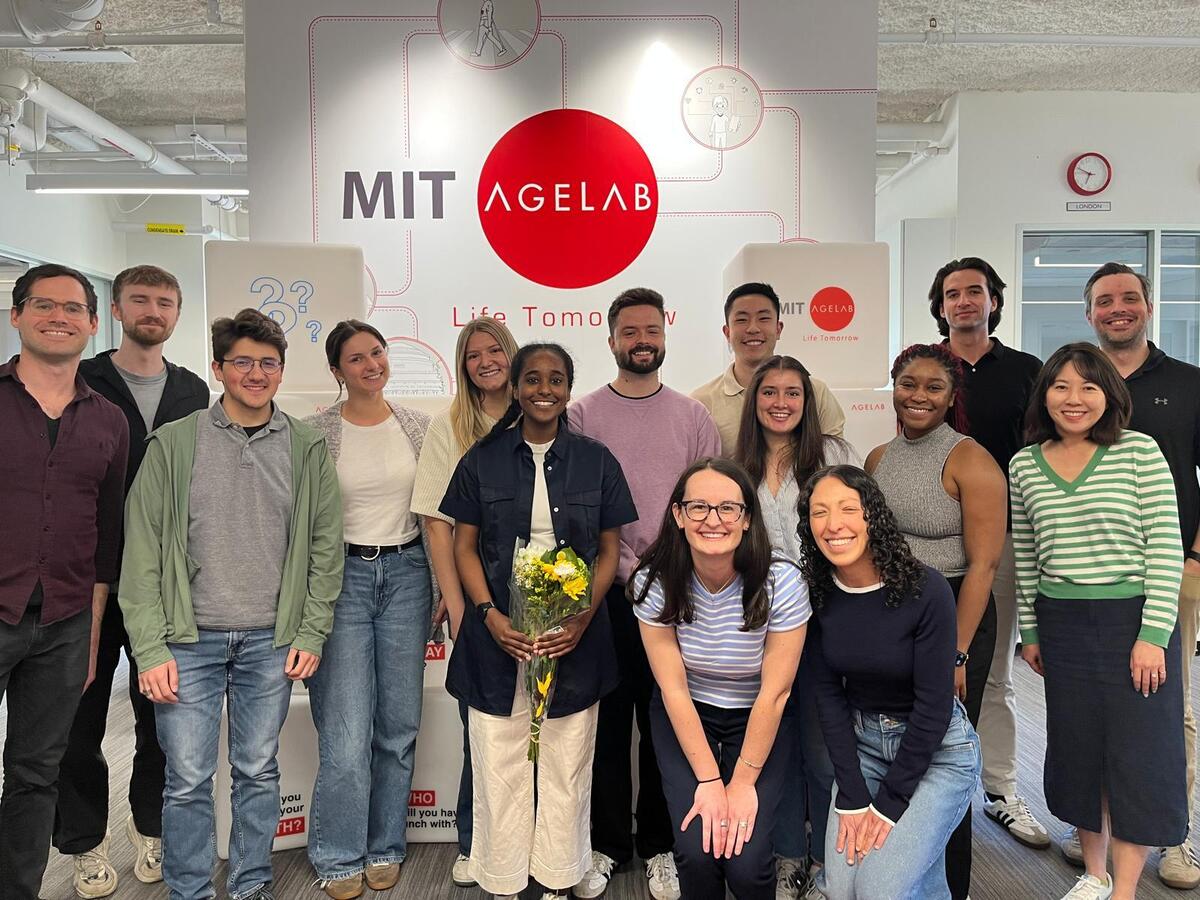 Ashebir, center, surrounded by AgeLab staff after her thesis defense
