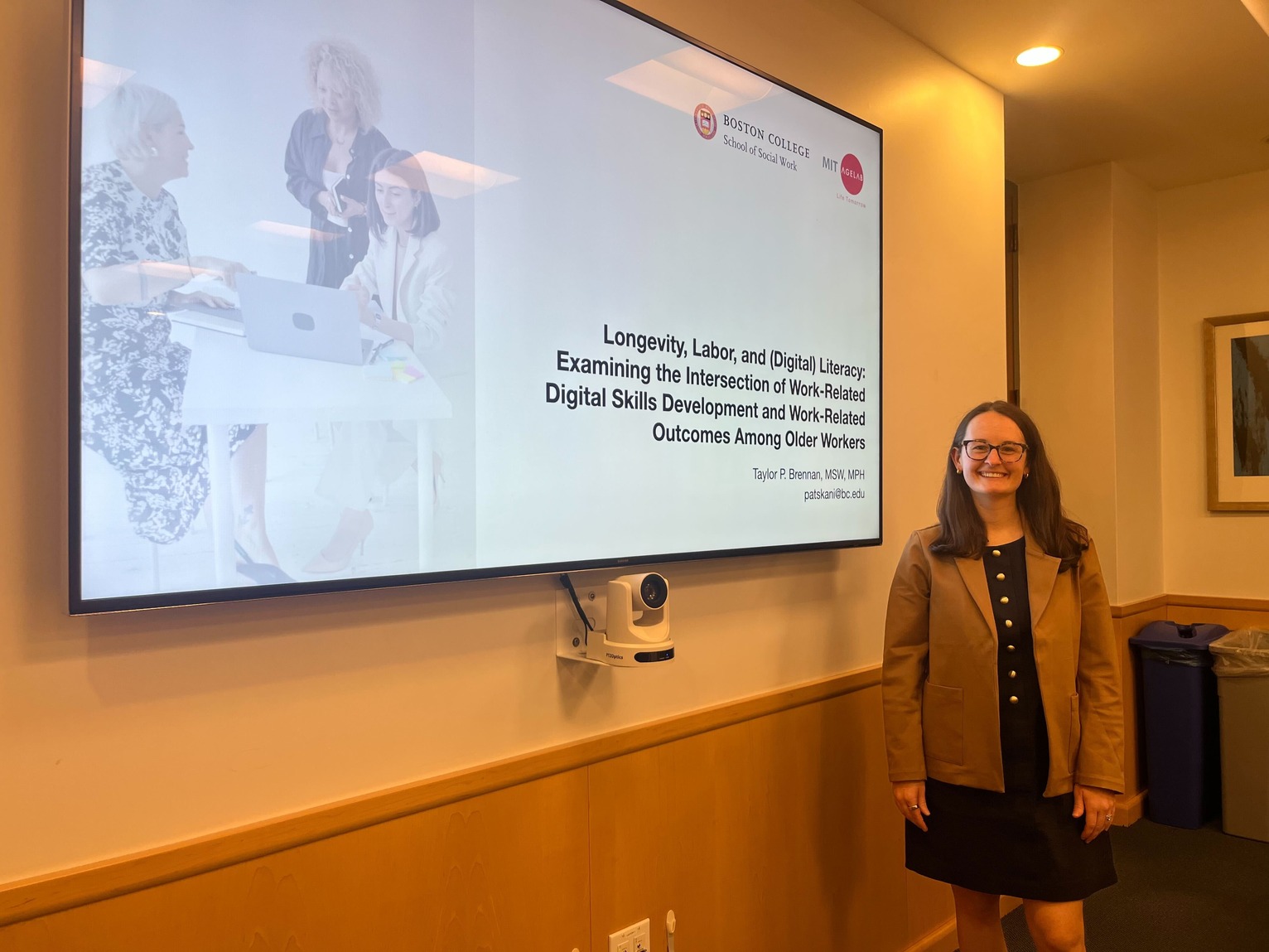 Brennan beside her presentation slides during her area statement defense